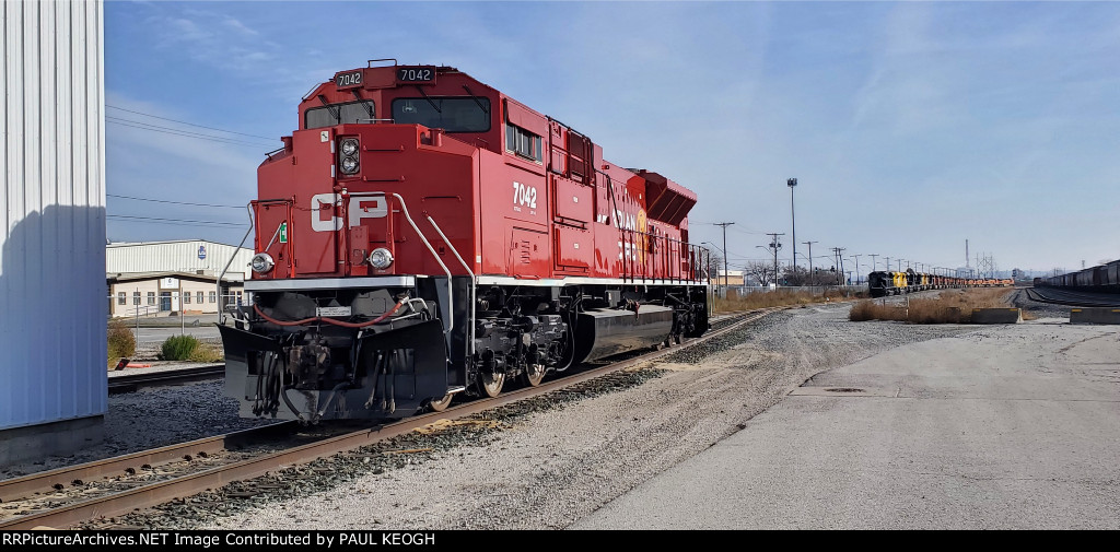 CP 7042 as The Morning Sun Reflects Of Her Canadian Pacific Beaver Tail Paint Job!!!.